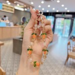 高级感夜光水晶柿子手机链包包钥匙挂件手机壳挂绳手提短款女批发