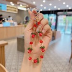 高级感夜光水晶柿子手机链包包钥匙挂件手机壳挂绳手提短款女批发